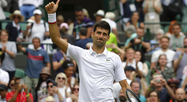 Serbia's Novak Djokovic celebrates defeating Ugo Humbert of France in a men's singles match during day seven of the Wimbledon Tennis Championships in London, Monday, July 8, 2019. AP DO NOT USE