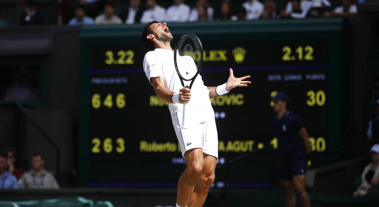Serbia's Novak Djokovic reacts as he plays against Spain's Roberto Bautista Agut in a Men's singles semifinal match on day eleven of the Wimbledon Tennis Championships in London, Friday, July 12, 2019. Serbia's Novak Djokovic reacts as he plays against Spain's Roberto Bautista Agut in a Men's singles semifinal match on day eleven of the Wimbledon Tennis Championships in London, Friday, July 12, 2019.