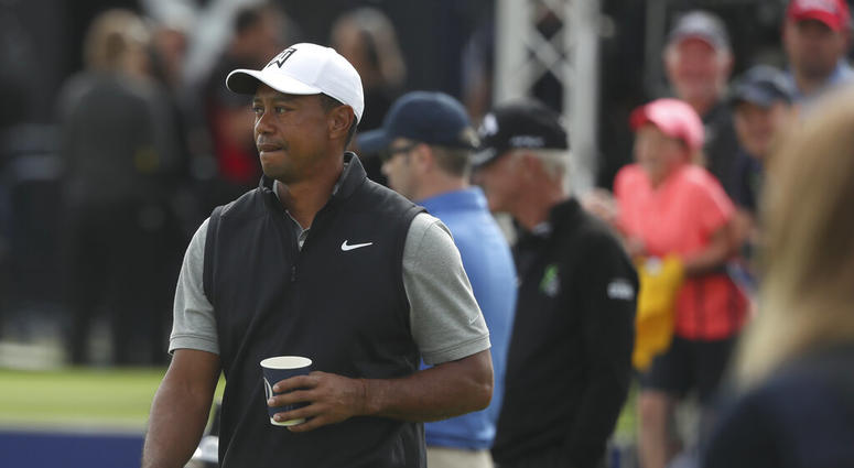 Tiger Woods of the United States holds a drink as he walks through the practice range ahead of the start of the British Open golf championships at Royal Portrush in Northern Ireland, Tuesday, July 16, 2019. The British Open starts Thursday. Tiger Woods of the United States holds a drink as he walks through the practice range ahead of the start of the British Open golf championships at Royal Portrush in Northern Ireland, Tuesday, July 16, 2019. The British Open starts Thursday.