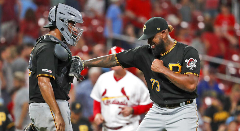 Pittsburgh Pirates relief pitcher Felipe Vazquez, right, celebrates with catcher Elias Diaz after the team's 3-1 victory over the St. Louis Cardinals in a baseball game Tuesday, July 16, 2019, in St. Louis.