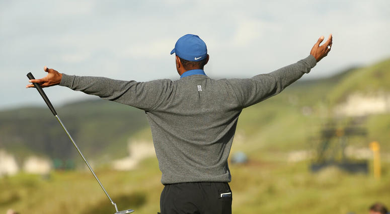 Tiger Woods of the United States celebrates after getting a birdie on the 16th green during the first round of the British Open Golf Championships at Royal Portrush in Northern Ireland, Thursday, July 18, 2019.