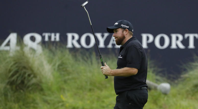 Ireland's Shane Lowry acknowledges the crowd after the competed his second round on the 18th green in British Open Golf Championships at Royal Portrush in Northern Ireland, Friday, July 19, 2019.