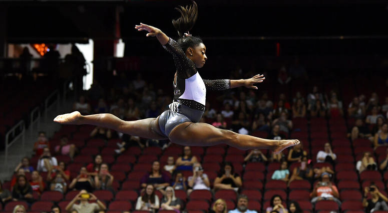 Simone Biles performs her balance beam routine during the GK US Classic gymnastics meet in Louisville, Ky., Saturday, July 20, 2019. Simone Biles performs her balance beam routine during the GK US Classic gymnastics meet in Louisville, Ky., Saturday, July 20, 2019.