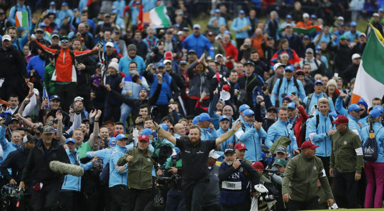 Ireland's Shane Lowry walks arms outstretched on the 18th green as he goes on to win the British Open Golf Championships at Royal Portrush in Northern Ireland, Sunday, July 21, 2019. Ireland's Shane Lowry walks arms outstretched on the 18th green as he goes on to win the British Open Golf Championships at Royal Portrush in Northern Ireland, Sunday, July 21, 2019.