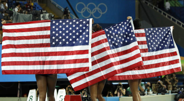 gold medal winner Brianna Rollins, center, silver medal winner Nia Ali, left, and bronze medal winner Kristi Castlin, all from the United States gold medal winner Brianna Rollins, center, silver medal winner Nia Ali, left, and bronze medal winner Kristi Castlin, all from the United States