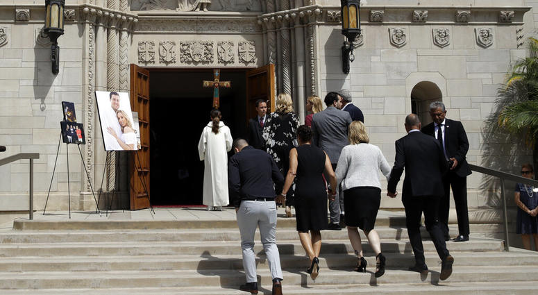 Members of Los Angeles Angels pitcher Tyler Skaggs' family hold hands as the walk into the St. Monica Catholic Church for a memorial service in his honor Monday, July 22, 2019, in Los Angeles. Members of Los Angeles Angels pitcher Tyler Skaggs' family hold hands as the walk into the St. Monica Catholic Church for a memorial service in his honor Monday, July 22, 2019, in Los Angeles.