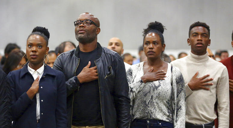 Mixed martial arts great Anderson "Spider" Silva of Brazil, his daughter Kaory, 23, left, his wife Dayane and son Kalyl, 20, right, recite the Pledge of Allegiance after all but Dayane were sworn in as U.S. citizens in a mass naturalization ceremony Tuesd Mixed martial arts great Anderson "Spider" Silva of Brazil, his daughter Kaory, 23, left, his wife Dayane and son Kalyl, 20, right, recite the Pledge of Allegiance after all but Dayane were sworn in as U.S. citizens in a mass naturalization ceremony Tuesd