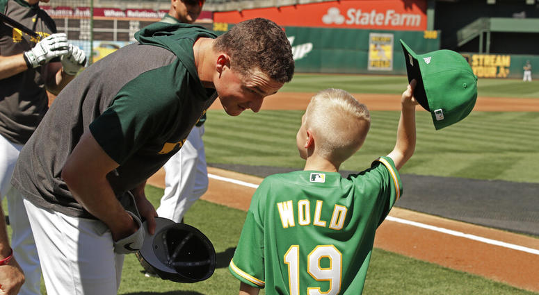 Eight-year-old August Wold (19) compares his haircut to Oakland Athletics' Matt Chapman's Eight-year-old August Wold (19) compares his haircut to Oakland Athletics' Matt Chapman's