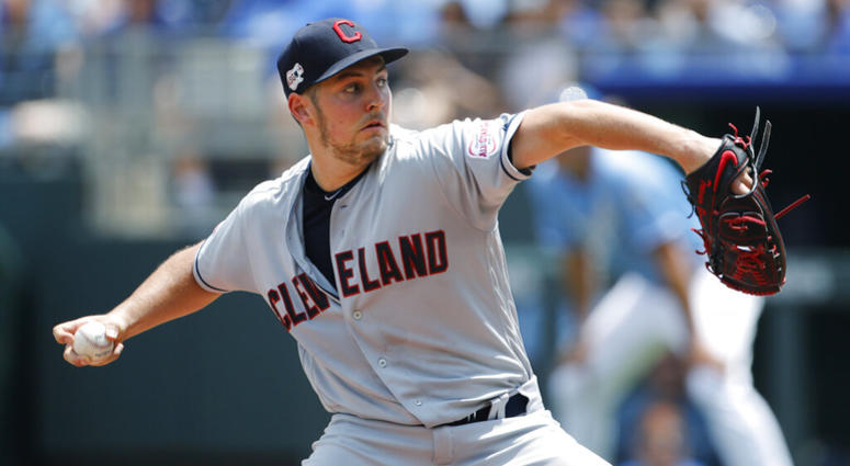 Cleveland Indians pitcher Trevor Bauer throws against the Kansas City Royals in the first inning of a baseball game at Kauffman Stadium in Kansas City, Mo., Sunday, July 28, 2019. AP DO NOT USE