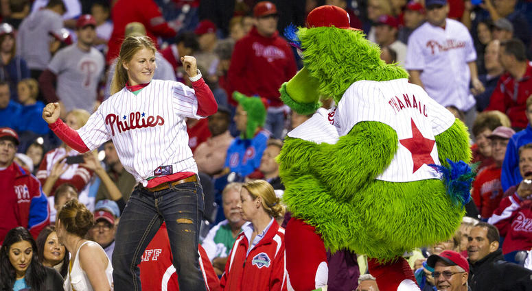 the Phillies Phanatic dancing with a fan the Phillies Phanatic dancing with a fan