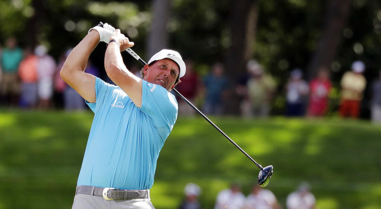 Phil Mickelson watches his tee shot on the 18th hole during the second round of the BMW Championship golf tournament at Medinah Country Club, Friday, Aug. 16, 2019, in Medinah, Ill. Phil Mickelson watches his tee shot on the 18th hole during the second round of the BMW Championship golf tournament at Medinah Country Club, Friday, Aug. 16, 2019, in Medinah, Ill.