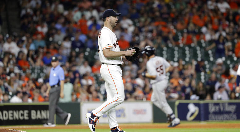 Houston Astros starting pitcher Justin Verlander walks off the mound after giving up a home run to Detroit Tigers' John Hicks (55) during the ninth inning of a baseball game Wednesday, Aug. 21, 2019, in Houston.