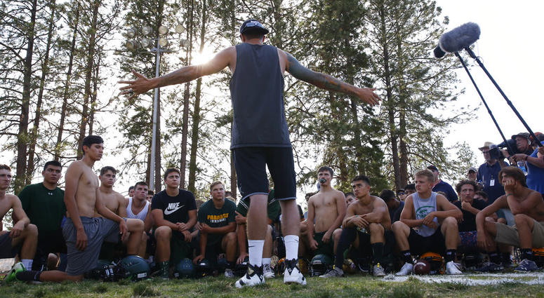 former Paradise High School football player Jeff Maehl, who played in the NFL, talks to the team after practice in Paradise, Calif. former Paradise High School football player Jeff Maehl, who played in the NFL, talks to the team after practice in Paradise, Calif.