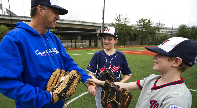 David Fox and his wife, Mary Ann, have a rule for their sons, 11-year-old Dewey and 8-year-old Jimmy: They have to play a team sport. David Fox and his wife, Mary Ann, have a rule for their sons, 11-year-old Dewey and 8-year-old Jimmy: They have to play a team sport.