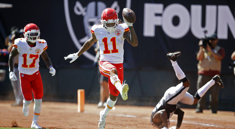 Kansas City Chiefs wide receiver Demarcus Robinson (11) celebrates after scoring a touchdown as teammate Mecole Hardman (17) looks on during the first half of an NFL football game against the Oakland Raiders Sunday, Sept. 15, 2019, in Oakland, Calif. AP DO NOT USE