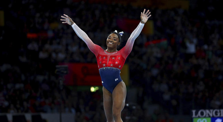 Simone Biles of the U.S. celebrates on the floor during women's team final at the Gymnastics World Championships in Stuttgart, Germany, Tuesday, Oct. 8, 2019. Simone Biles of the U.S. celebrates on the floor during women's team final at the Gymnastics World Championships in Stuttgart, Germany, Tuesday, Oct. 8, 2019.