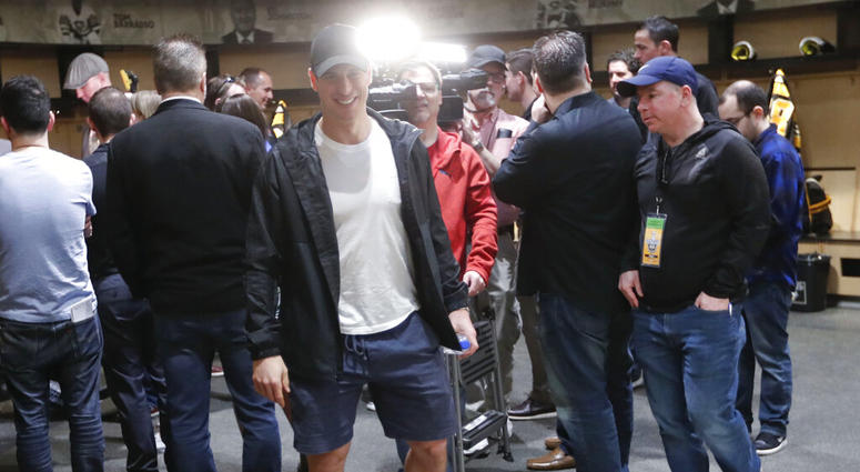 Pittsburgh Penguins' Sidney Crosby walks from reporters after talking with them in the practice facility locker room before leaving for the off season two days after being swept by the New York Islanders AP DO NOT USE