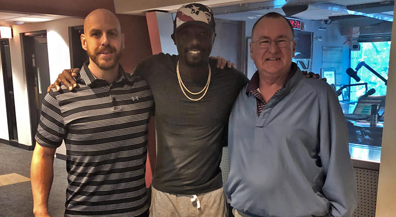 Santonio Holmes with Colin and Jim