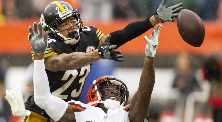 Pittsburgh Steelers defensive back Joe Haden (23) breaks up a pass intended for Cleveland Browns wide receiver Josh Gordon (12) during the third quarter at FirstEnergy Stadium.