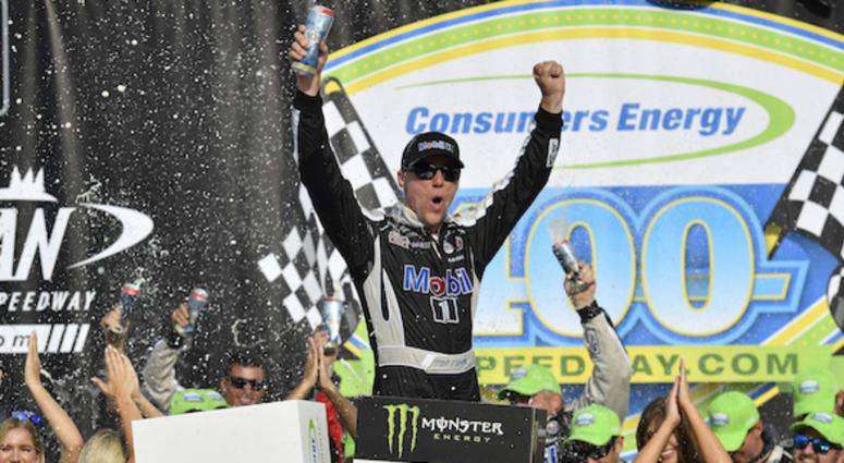 Kevin Harvick, driver of the #4 Mobil 1 Ford, celebrates in Victory Lane after winning the Monster Energy NASCAR Cup Series Consumers Energy 400 at Michigan International Speedway on August 11, 2019 in Brooklyn, Michigan. Stewart Haas Racing's Kevin Harvick Celebrates In Victory Lane At Michigan International Speedway