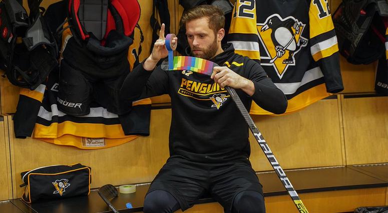 Bryan Rust tapes up his stick