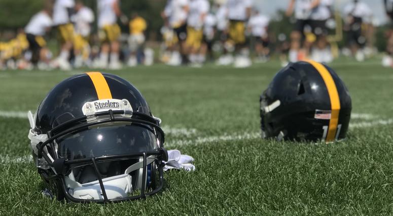 Steelers helmets on the field at Saint Vincent College in 2019 training camp