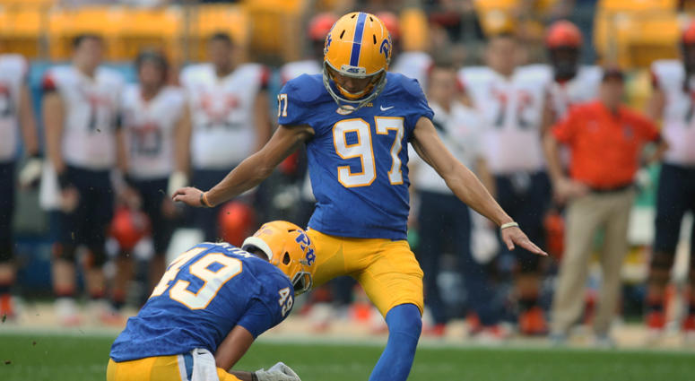 Pittsburgh Panthers place kicker Alex Kessman (97) kicks a fifty-five yard field goal from the hold of Jake Scarton (49) against the Syracuse Orange during the second quarter at Heinz Field.