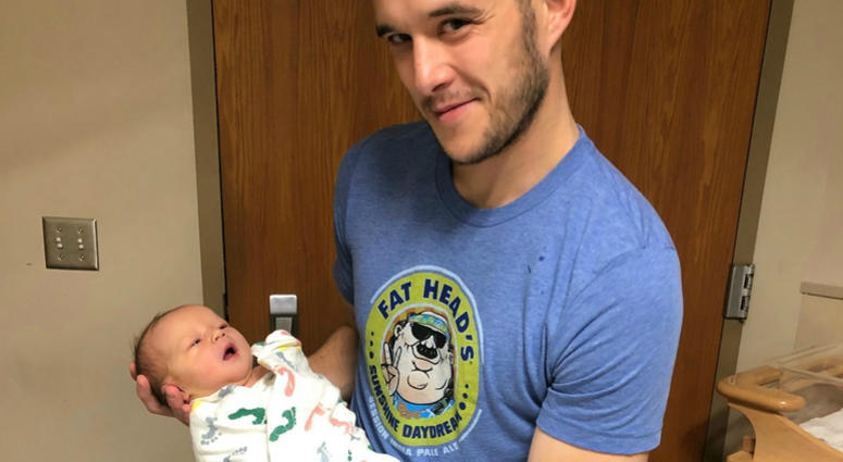 Chris Mueller with his newborn son Lennox