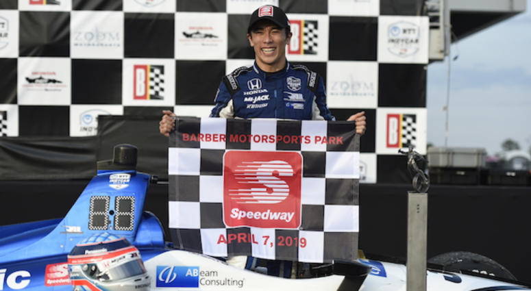 Takuma Sato Holds Up Checkered Flag After Winning Honda IndyCar Grand Prix Of Alabama Rahal Letterman Lanigan's Takuma Sato Celebrates After Winning The Honda IndyCar Grand Prix Of Alabama