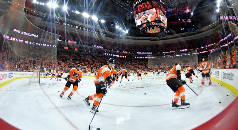 Philadelphia Flyers warm up before a hockey game