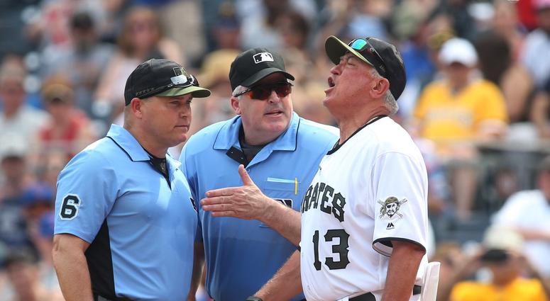 First base umpire Mark Carlson (6) and home plate umpire Bill Welke (middle) listen to Pittsburgh Pirates manager Clint Hurdle (13) after Hurdle is ejected during the eighth inning First base umpire Mark Carlson (6) and home plate umpire Bill Welke (middle) listen to Pittsburgh Pirates manager Clint Hurdle (13) after Hurdle is ejected during the eighth inning
