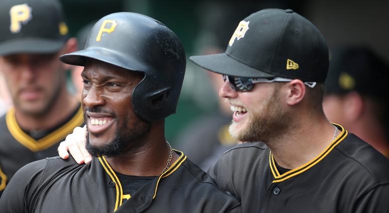 Starling Marte (L) celebrates his home run with outfielder Austin Meadows (