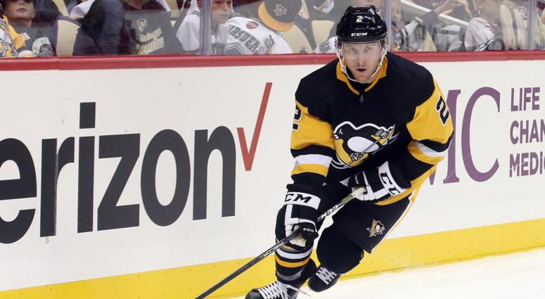 Pittsburgh Penguins defenseman Chad Ruhwedel (2) skates with the puck against the Detroit Red Wings during the third period at PPG PAINTS Arena.