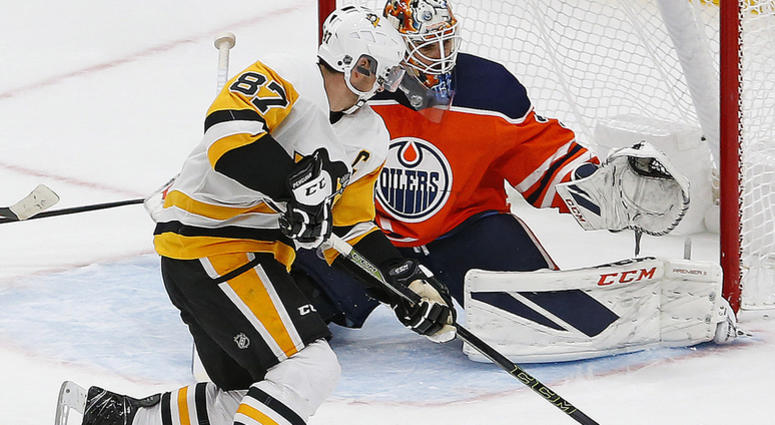 Sidney Crosby scores the overtime winning goal against Edmonton Oilers goaltender Cam Talbot Sidney Crosby scores the overtime winning goal against Edmonton Oilers goaltender Cam Talbot