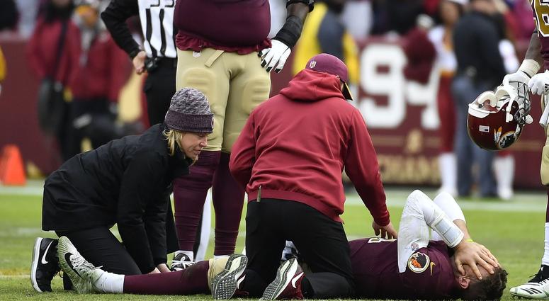 Washington Redskins quarterback Alex Smith (11) reacts after breaking his leg in the second half against the Houston Texans Washington Redskins quarterback Alex Smith (11) reacts after breaking his leg in the second half against the Houston Texans