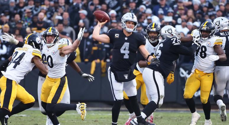 Raiders QB Derek Carr throws the ball against the Pittsburgh Steelers