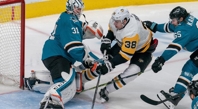 San Jose Sharks goaltender Martin Jones (31) makes a save against Pittsburgh Penguins center Derek Grant (38) during the third period the at SAP Center at San Jose.