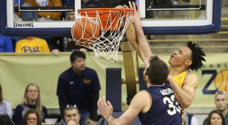 Pittsburgh Panthers guard Trey McGowens (2) dunks against Notre Dame Fighting Irish forward John Mooney (33) during the first half at the Petersen Events Center.