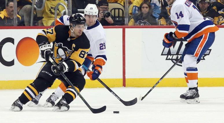 Pittsburgh Penguins center Sidney Crosby (87) handles the puck against New York Islanders center Brock Nelson (29) during the third period in game three of the first round of the 2019 Stanley Cup Playoffs