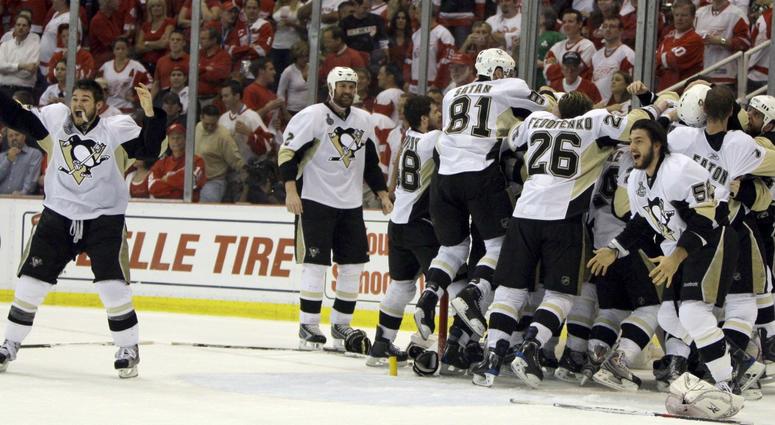 Penguins players react after capturing the franchise's third Stanley Cup