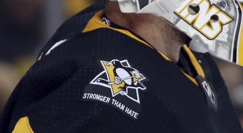 A commemorative patch honoring the victims the Tree of Life Synagogue massacre is displayed on the jersey of Pittsburgh Penguins goaltender Matt Murray (30) against the New York Islanders