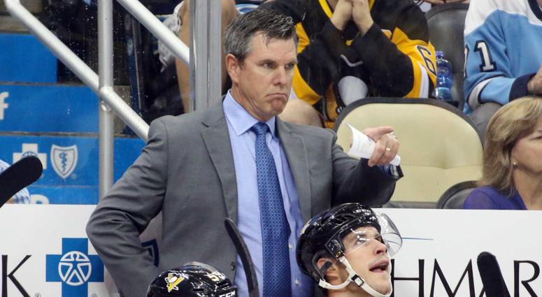 Pittsburgh Penguins head coach Mike Sullivan (top) gestures on the bench against the Montreal Canadiens during the second period at PPG PAINTS Arena. Montreal won 5-1.