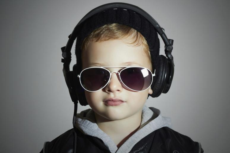 Little boy listens to music through headphones Little boy listens to music through headphones