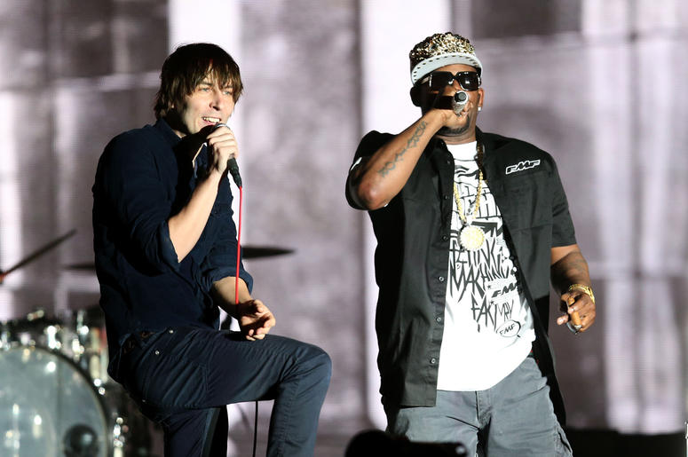 Thomas Mars of Phoenix and R&B singer R. Kelly INDIO, CA - APRIL 13: Rapper R. Kelly (R) performs with musician Thomas Mars (L) of Phoenix onstage during day 2 of the 2013 Coachella Valley Music & Arts Festival at the Empire Polo Club on April 13, 2013 in Indio, California. (Photo by Christopher Polk/
