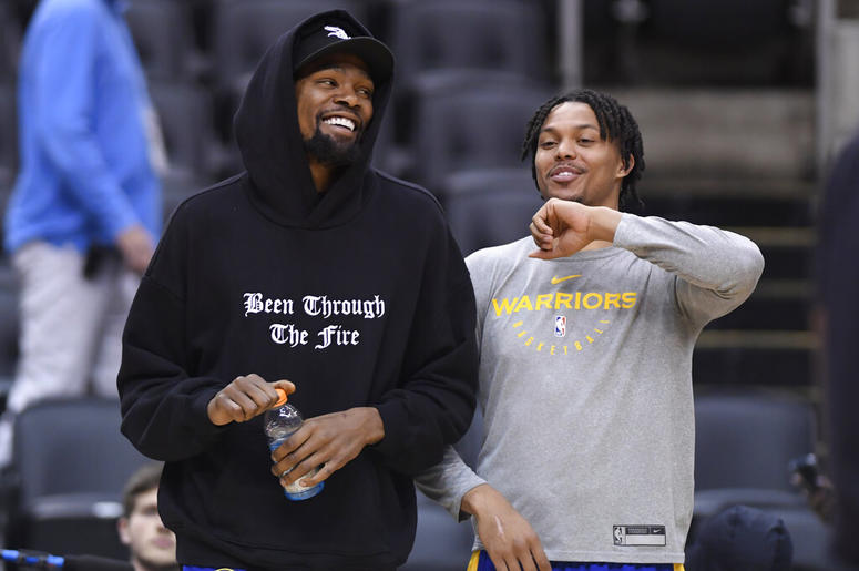 Golden State Warriors Kevin Durant laughs with teammate Damion Lee Golden State Warriors Kevin Durant laughs with teammate Damion Lee