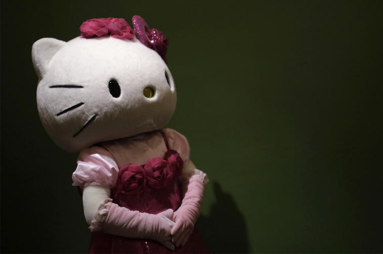 AP19190483751582 In this Thursday, Oct. 30, 2014 file photo, a model dressing as Japanese character Hello Kitty waits for guests to pose for a souvenir photo at Sanrio Puroland, a theme park featuring Hello Kitty in Tokyo. (AP Photo/Eugene Hoshiko, File)