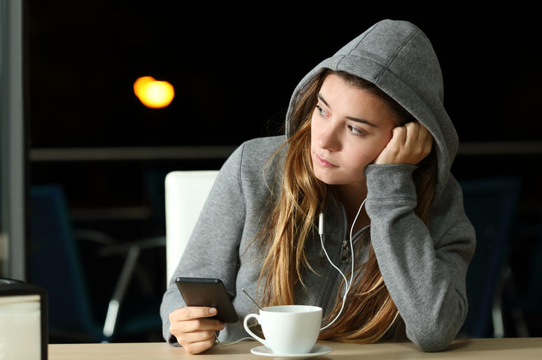 Sad girl listening to music