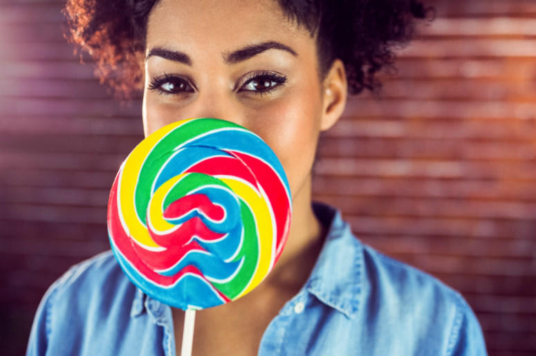 Woman holds giant lollipop 100.3 Jack FM,Firebox,Online,Shopping,Lollipop,Life-sized,Face,Custom,Funny,Gift,Candy