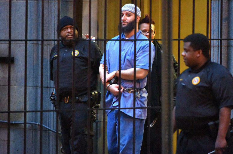 Officials escort "Serial" podcast subject Adnan Syed from the courthouse on Feb. 3, 2016, following the completion of the first day of hearings for a retrial in Baltimore. Serial,Podcast,Adnan Syed,Case,Murder,Investigation,HBO,Documentary,Baltimore,Hae Min Lee,Amy Berg,Sky,100.3 Jack FM