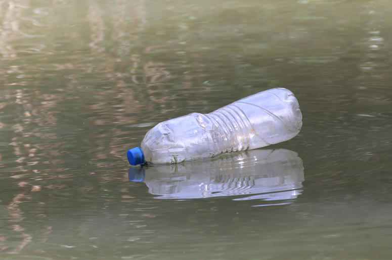 A Plastic Bottle Waste On the water surface dirty, Rotten water, Bottle Waste Plastic Bottle Waste On the water surface dirty, Rotten water, Bottle Waste (Photo credit: Amnat Buakeaw)
